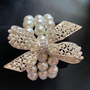 White Three Strand Faux Pearl Bracelet with 3 Inch Bow.